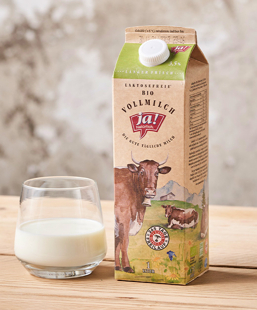 Glas und Verpackung laktosefreier Vollmilch - Ja! Natürlich